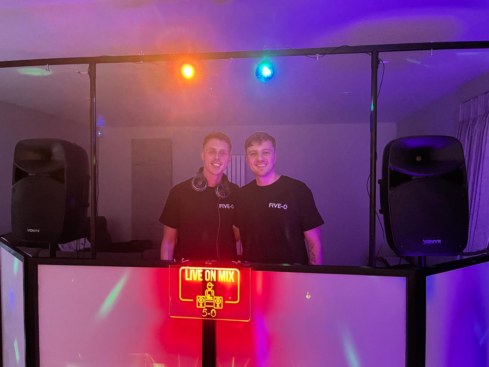 Five-O DJ full booth setup with speakers and lighting